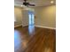 Large bedroom featuring hardwood floors and a ceiling fan at 240 Dogwood Dr, Canton, GA 30114