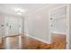 Inviting foyer with hardwood floors and a view into an adjacent room at 240 Dogwood Dr, Canton, GA 30114