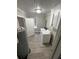 Functional laundry room with white appliances and convenient storage at 240 Dogwood Dr, Canton, GA 30114