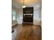 Inviting living room featuring hardwood floors, a fireplace and custom built-ins at 240 Dogwood Dr, Canton, GA 30114