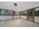 Relaxing sunroom with wooden floors and a backyard view at 240 Dogwood Dr, Canton, GA 30114