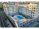 Aerial view of apartment building with pool and surrounding cityscape at 805 Peachtree St # 515, Atlanta, GA 30308