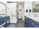 Modern bathroom with navy blue vanity and walk-in shower at 805 Peachtree St # 515, Atlanta, GA 30308