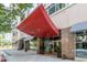 Modern building entrance with red canopy at 805 Peachtree St # 515, Atlanta, GA 30308
