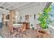 Spacious dining area with hardwood floors and large windows at 805 Peachtree St # 515, Atlanta, GA 30308