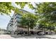 Building exterior, featuring retail spaces and landscaping at 805 Peachtree St # 515, Atlanta, GA 30308
