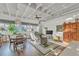 Open living room with hardwood floors, large windows, and ceiling fan at 805 Peachtree St # 515, Atlanta, GA 30308
