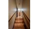 Wooden stairway leading to the upper level of the home at 4549 Bedford Pl, Douglasville, GA 30135