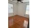 Bedroom with hardwood floors and two windows at 101 Ellis Dr # 101, Conyers, GA 30012