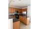 Spacious kitchen with an island, stainless steel appliances, and wood cabinets at 101 Ellis Dr # 101, Conyers, GA 30012