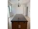 Kitchen island with dark countertop and wood base at 101 Ellis Dr # 101, Conyers, GA 30012
