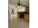 Kitchen with island, wood cabinets, and tile floor at 101 Ellis Dr # 101, Conyers, GA 30012