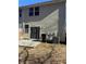 Rear view of the townhome showcasing a sliding glass door and patio at 101 Ellis Dr # 101, Conyers, GA 30012
