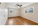 Spacious bedroom with hardwood floors, ceiling fan and window at 148 Walker Nw Rd, Cartersville, GA 30121