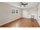 Well-lit bedroom with hardwood floors, built-in shelving and double closets at 148 Walker Nw Rd, Cartersville, GA 30121