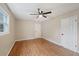 Bright bedroom with hardwood floors and ceiling fan at 148 Walker Nw Rd, Cartersville, GA 30121