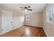Bright bedroom featuring hardwood floors, ceiling fan and ample closet space at 148 Walker Nw Rd, Cartersville, GA 30121