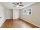Hardwood floor bedroom with double door closet and ceiling fan at 148 Walker Nw Rd, Cartersville, GA 30121