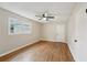 Spacious bedroom with hardwood floors and ceiling fan at 148 Walker Nw Rd, Cartersville, GA 30121