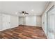 Gathering room with wood-look flooring, shiplap accent wall, and sliding doors at 148 Walker Nw Rd, Cartersville, GA 30121