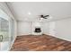 Gathering room with wood-look flooring, fireplace, and sliding glass doors at 148 Walker Nw Rd, Cartersville, GA 30121