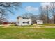 Side view of the house showcasing white exterior and shed at 148 Walker Nw Rd, Cartersville, GA 30121