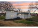 Rear view of house showcasing white brick exterior and landscaping at 148 Walker Nw Rd, Cartersville, GA 30121