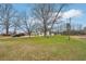 Front yard view of the house and surrounding landscape at 148 Walker Nw Rd, Cartersville, GA 30121