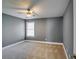 Spacious bedroom with gray walls and carpet at 6269 Colonial Vw, Fairburn, GA 30213
