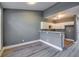 Modern kitchen features white cabinets and gray walls at 6269 Colonial Vw, Fairburn, GA 30213