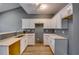 Modern kitchen with white cabinets, quartz countertops, and double sink at 6269 Colonial Vw, Fairburn, GA 30213