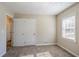 Well-lit bedroom with carpet and double door closet at 2182 Loring Ct, Decatur, GA 30032