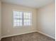Well-lit bedroom with neutral walls and carpeted floors at 2182 Loring Ct, Decatur, GA 30032