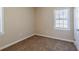 Bright bedroom with neutral walls and carpet at 2182 Loring Ct, Decatur, GA 30032