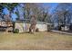 House exterior with mature trees and a yard at 2182 Loring Ct, Decatur, GA 30032