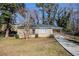 Ranch style home with driveway and landscaped yard at 2182 Loring Ct, Decatur, GA 30032