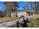Front view of charming ranch house with a long driveway at 2182 Loring Ct, Decatur, GA 30032
