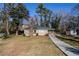 Front view of a charming tan brick ranch house with a paved walkway and yard at 2182 Loring Ct, Decatur, GA 30032