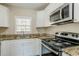 Updated kitchen, featuring granite countertops and stainless steel appliances at 2182 Loring Ct, Decatur, GA 30032