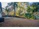 Spacious backyard with a partially-fenced area and mature trees providing shade at 93 Sterling Ridge Dr, Jonesboro, GA 30238