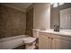 Clean bathroom with a white vanity, tile shower, and updated fixtures at 93 Sterling Ridge Dr, Jonesboro, GA 30238