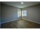 Spacious bedroom with hardwood floors and large window at 93 Sterling Ridge Dr, Jonesboro, GA 30238