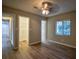 Bright bedroom featuring a large closet, wood-look floors, and a window with blinds at 93 Sterling Ridge Dr, Jonesboro, GA 30238