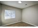 Well-lit bedroom with hardwood floors and a window at 93 Sterling Ridge Dr, Jonesboro, GA 30238