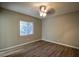 Simple bedroom with hardwood floors and a ceiling fan at 93 Sterling Ridge Dr, Jonesboro, GA 30238