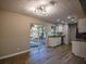 Bright dining area with hardwood floors, kitchen access, and backyard views at 93 Sterling Ridge Dr, Jonesboro, GA 30238