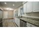 Modern kitchen with stainless steel appliances and granite countertops at 93 Sterling Ridge Dr, Jonesboro, GA 30238