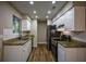 Modern kitchen with stainless steel appliances and granite countertops at 93 Sterling Ridge Dr, Jonesboro, GA 30238