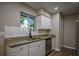 Updated kitchen with granite countertops and white cabinets at 93 Sterling Ridge Dr, Jonesboro, GA 30238