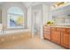 Bathroom with garden tub, separate shower, and updated vanity at 3356 Renfro St, Marietta, GA 30066